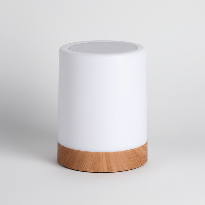 Close-up view of the minimalist white and wood-grain LED night light