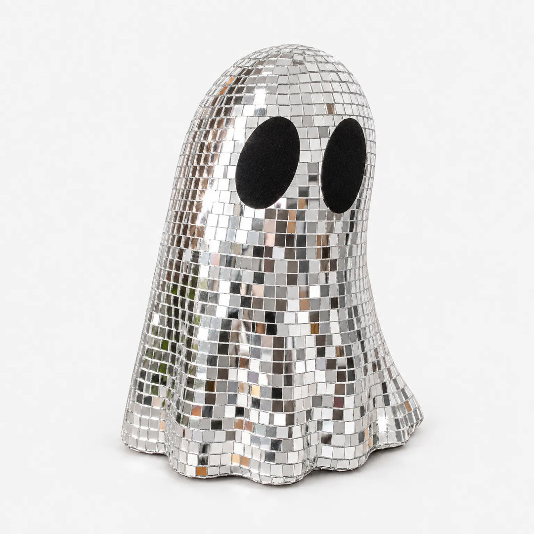 Sparkly disco ghost figurine used as a retro Halloween party centerpiece