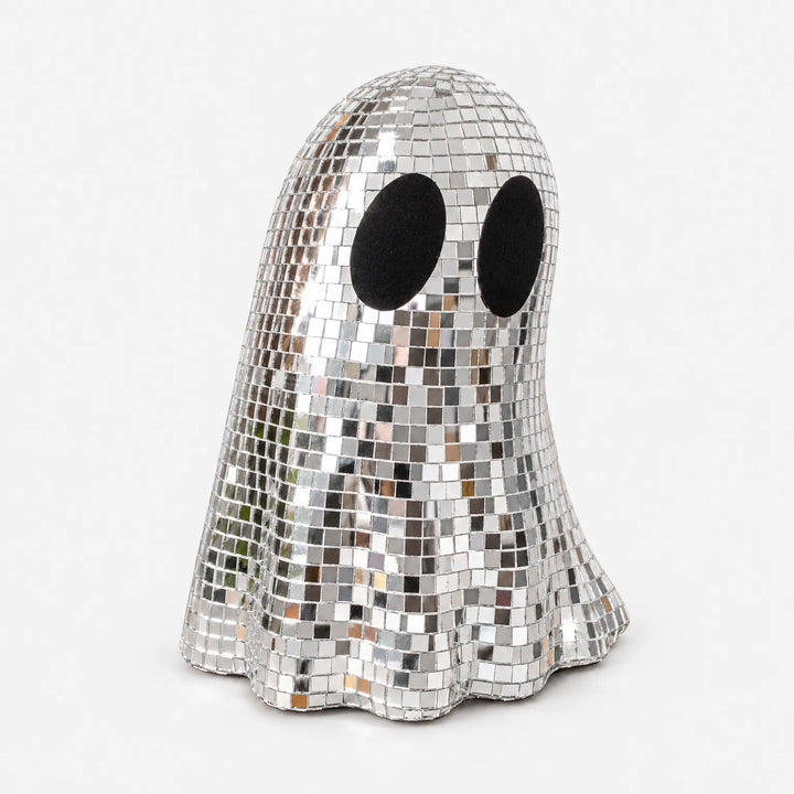 Sparkly disco ghost figurine used as a retro Halloween party centerpiece
