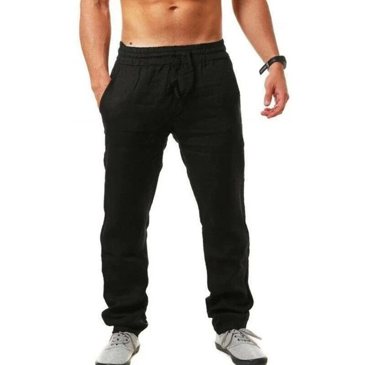 Man wearing black breathable summer trousers with drawstring