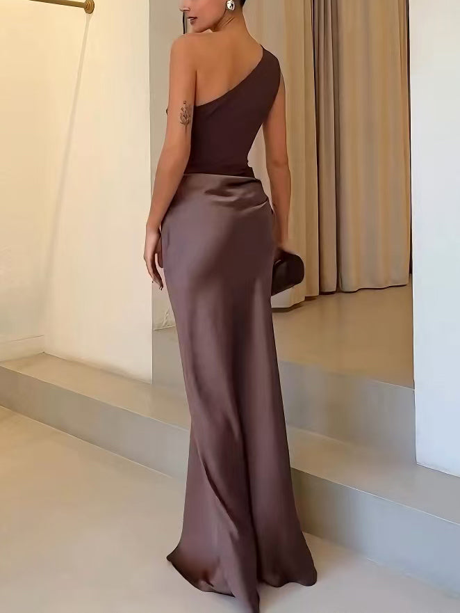 Close-up of pleated fabric and one-shoulder strap on evening party gown