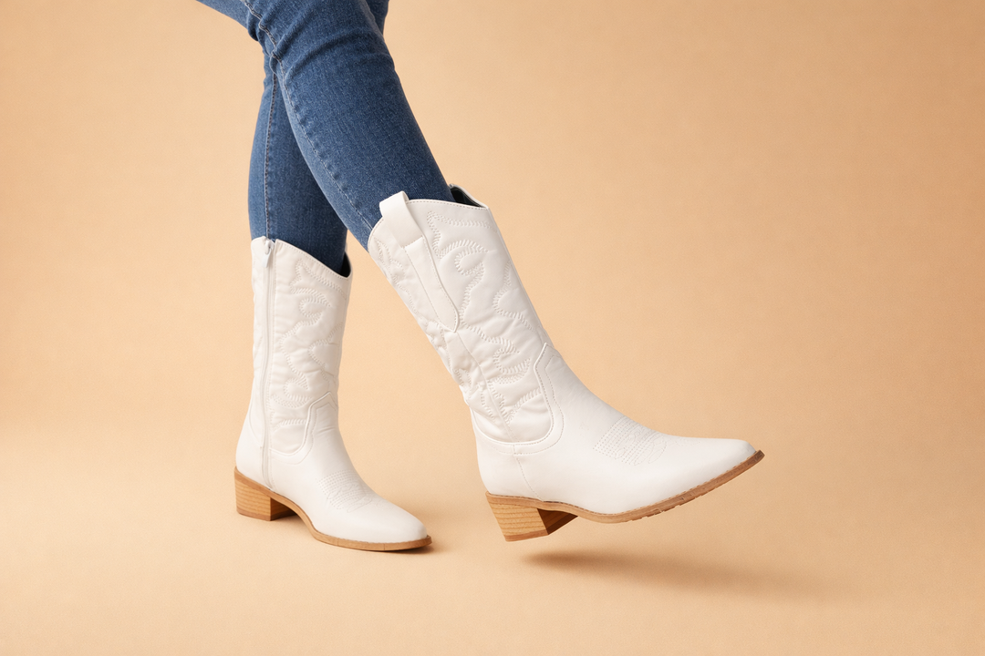 Close up view of the western stitching and stacked heel on fashionable retro boots.