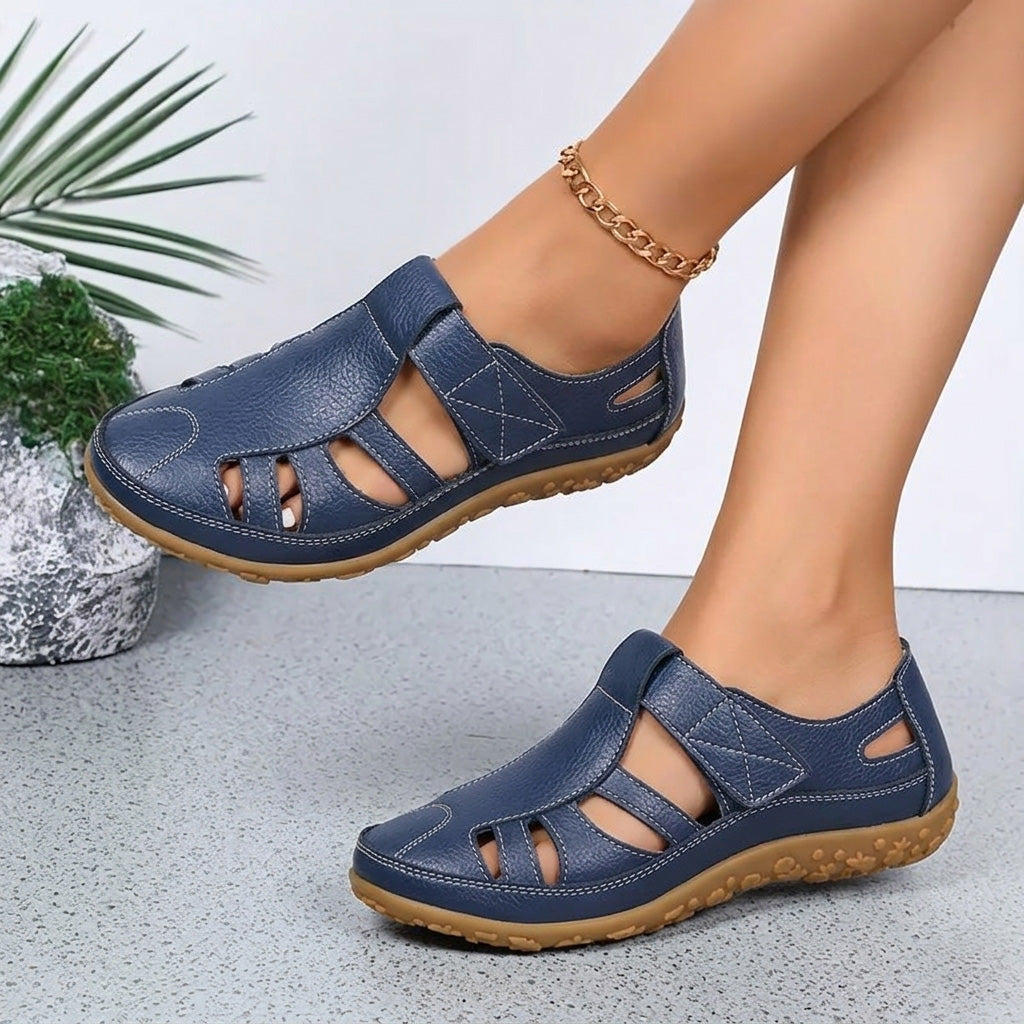 A woman wearing blue breathable walking sandals