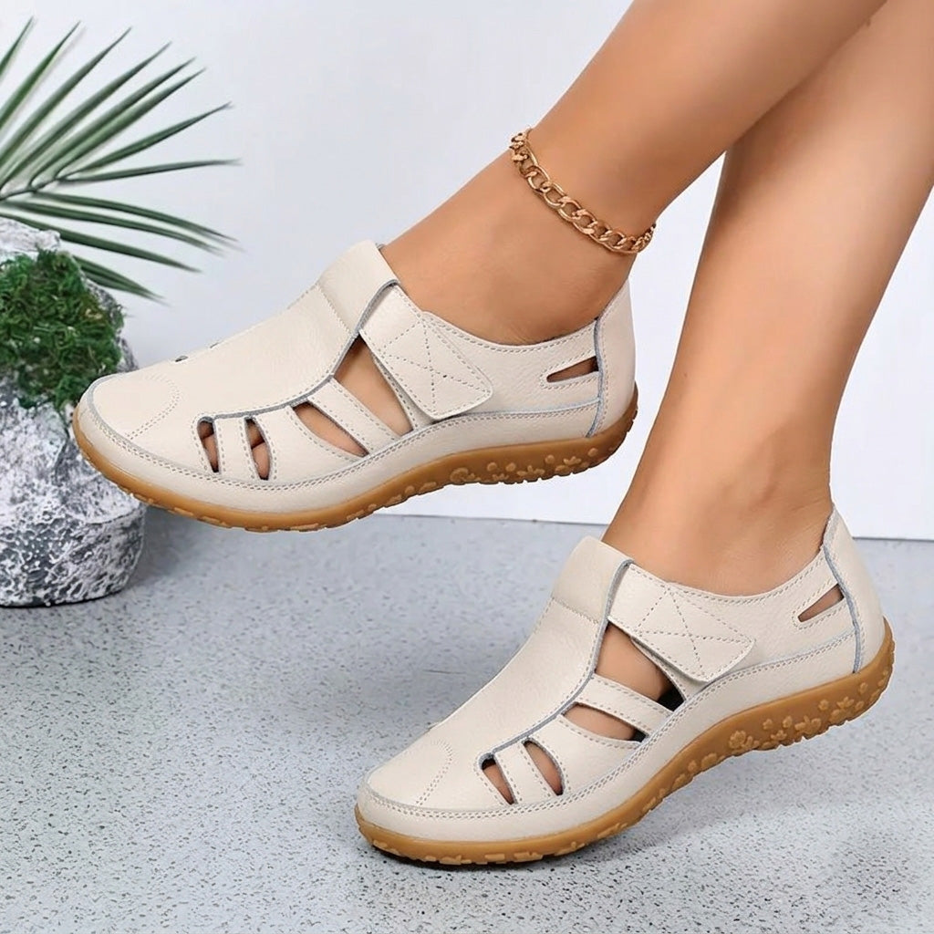 Side profile of summer footwear with orthotic arch support and lightweight walking sole
