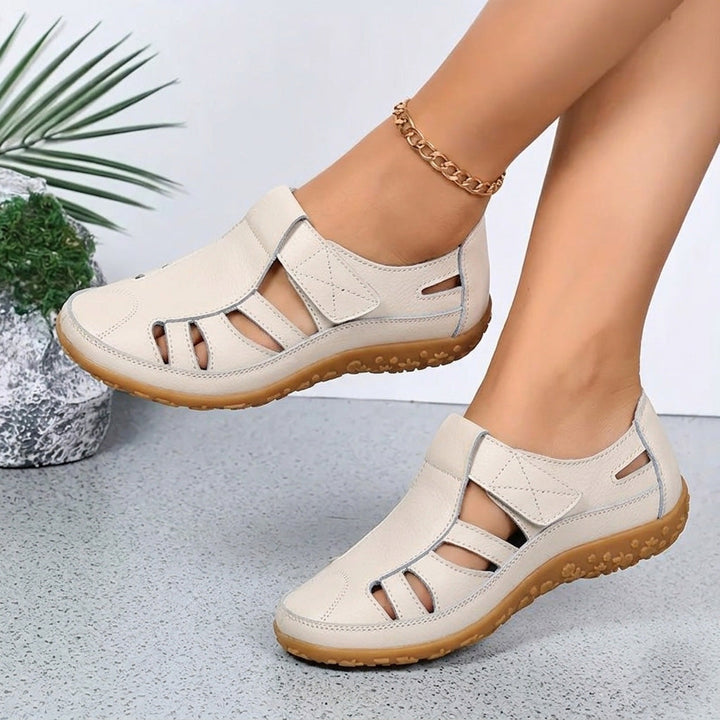 Side profile of summer footwear with orthotic arch support and lightweight walking sole