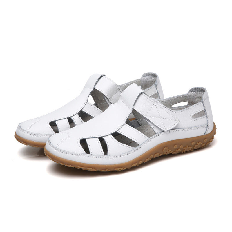 Womens flat sandals featuring adjustable hook-and-loop straps for a secure fit