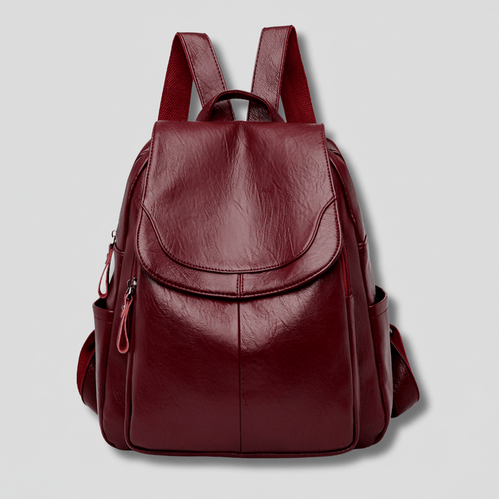 Grey women's elegant anti-theft backpack showcasing front zipper pocket and stylish design