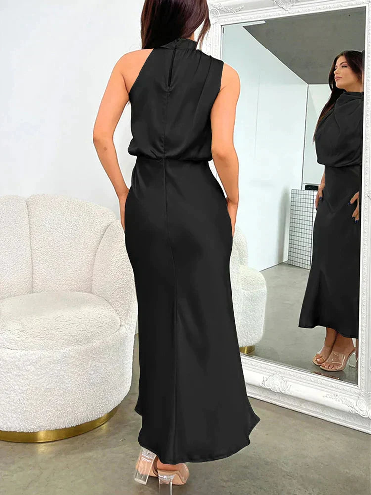 Women's elegant halter neck midi dress back view showing zipper and sleek fit
