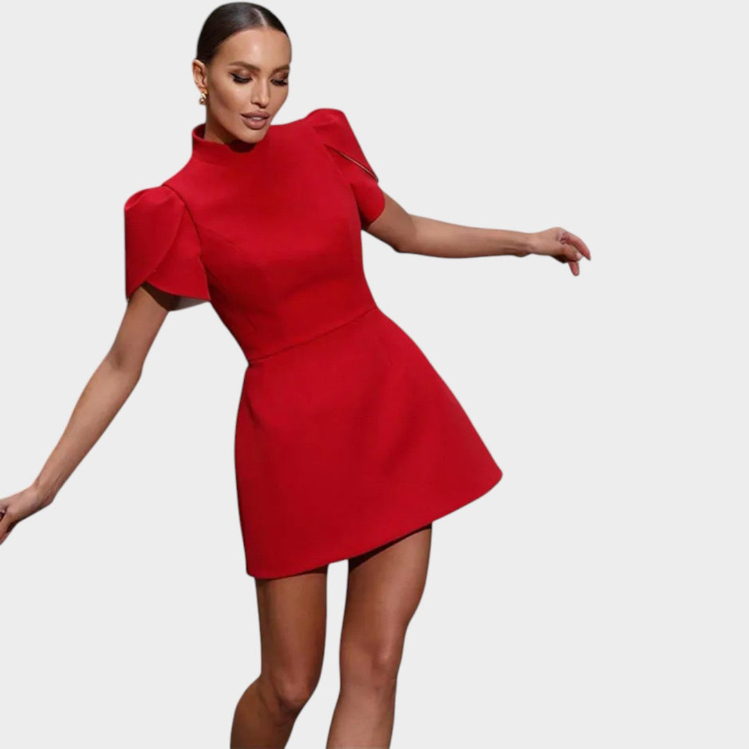 Full view of the red party dress with structured silhouette and movement