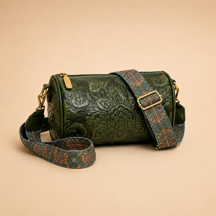 Green vintage embossed floral pattern cylinder crossbody bag with decorative strap