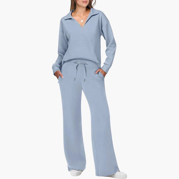 Model wearing light blue two-piece set with V-neck top and wide-leg pants