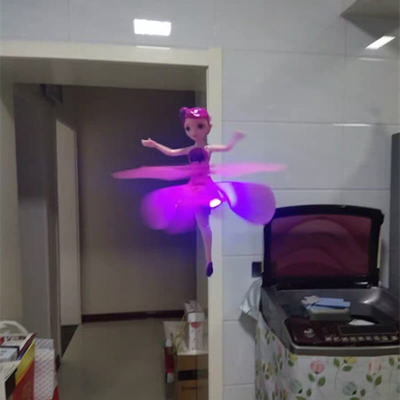 Magic doll flying toy glowing and hovering indoors during playtime