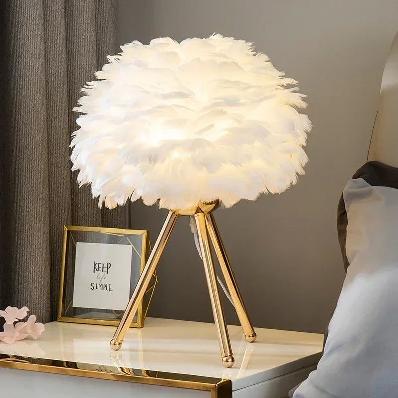 Goose Down Table Lamp with white gold base glowing warmly