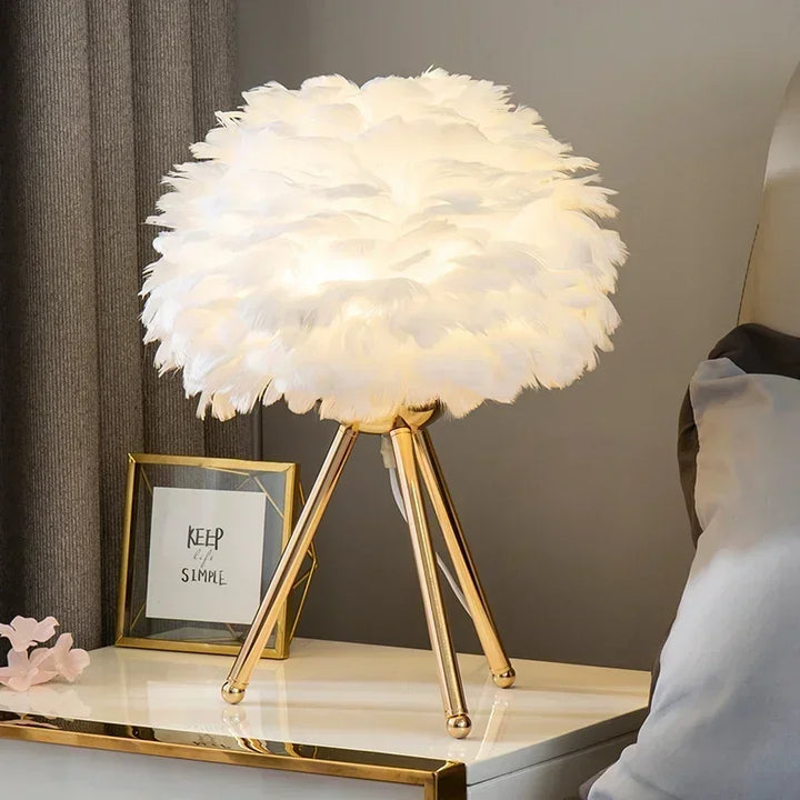 Goose Down Table Lamp with white gold base glowing warmly