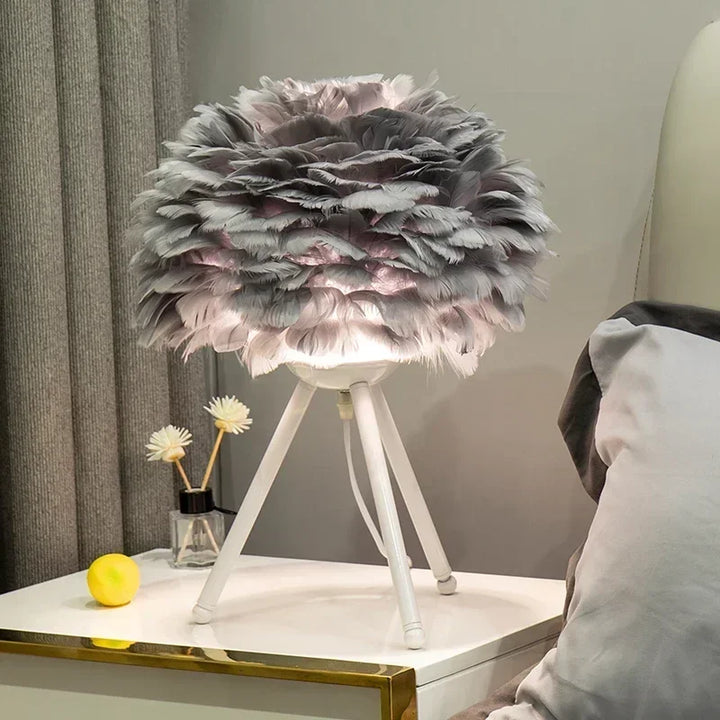 Fluffy feather accent light showing the texture and warm glow of the bedroom lamp