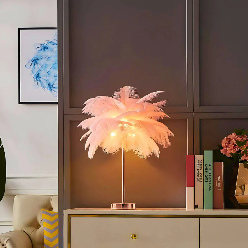 Pink feather table lamp casting a soft glow in a modern living room setting