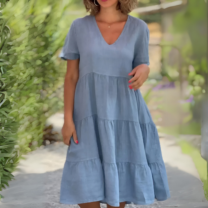 Woman modeling a light blue casual V-neck dress