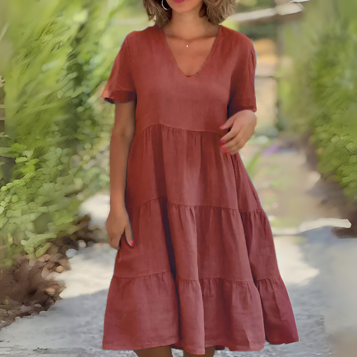 Back view of a breezy V-neck summer dress for women, lightweight midi fit