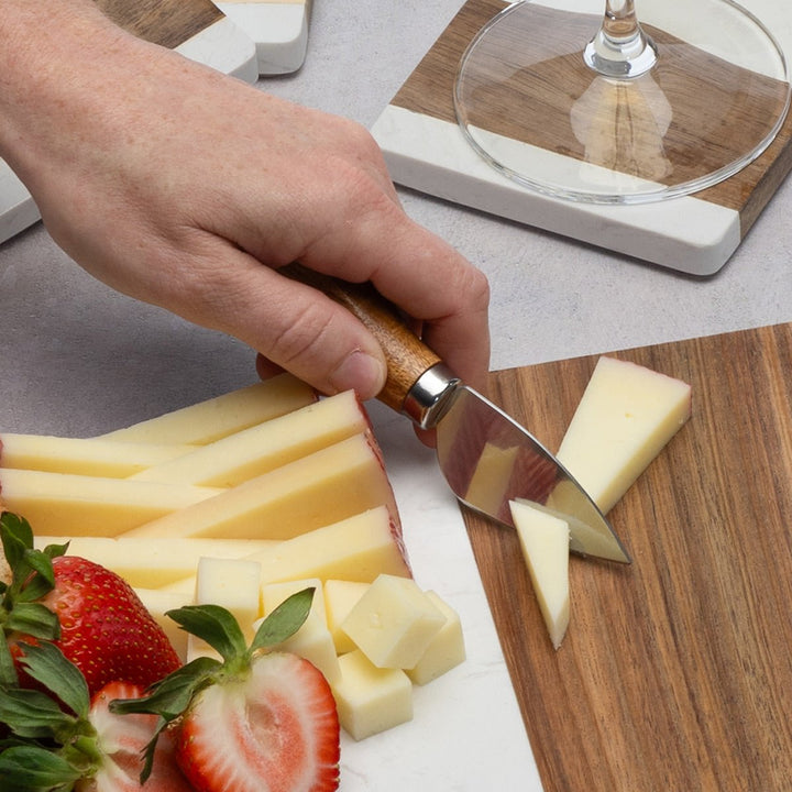 Four-piece cheese knife set with ergonomic wooden handles for charcuterie boards
