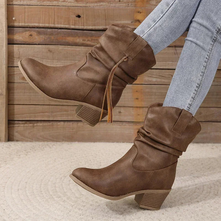 Side profile of water resistant boho ankle boots with stacked heel