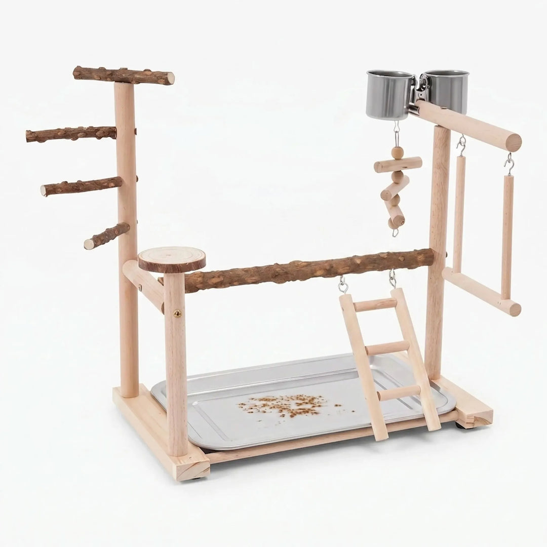 Freestanding wooden bird playground with ladder and feeding cups on a white background