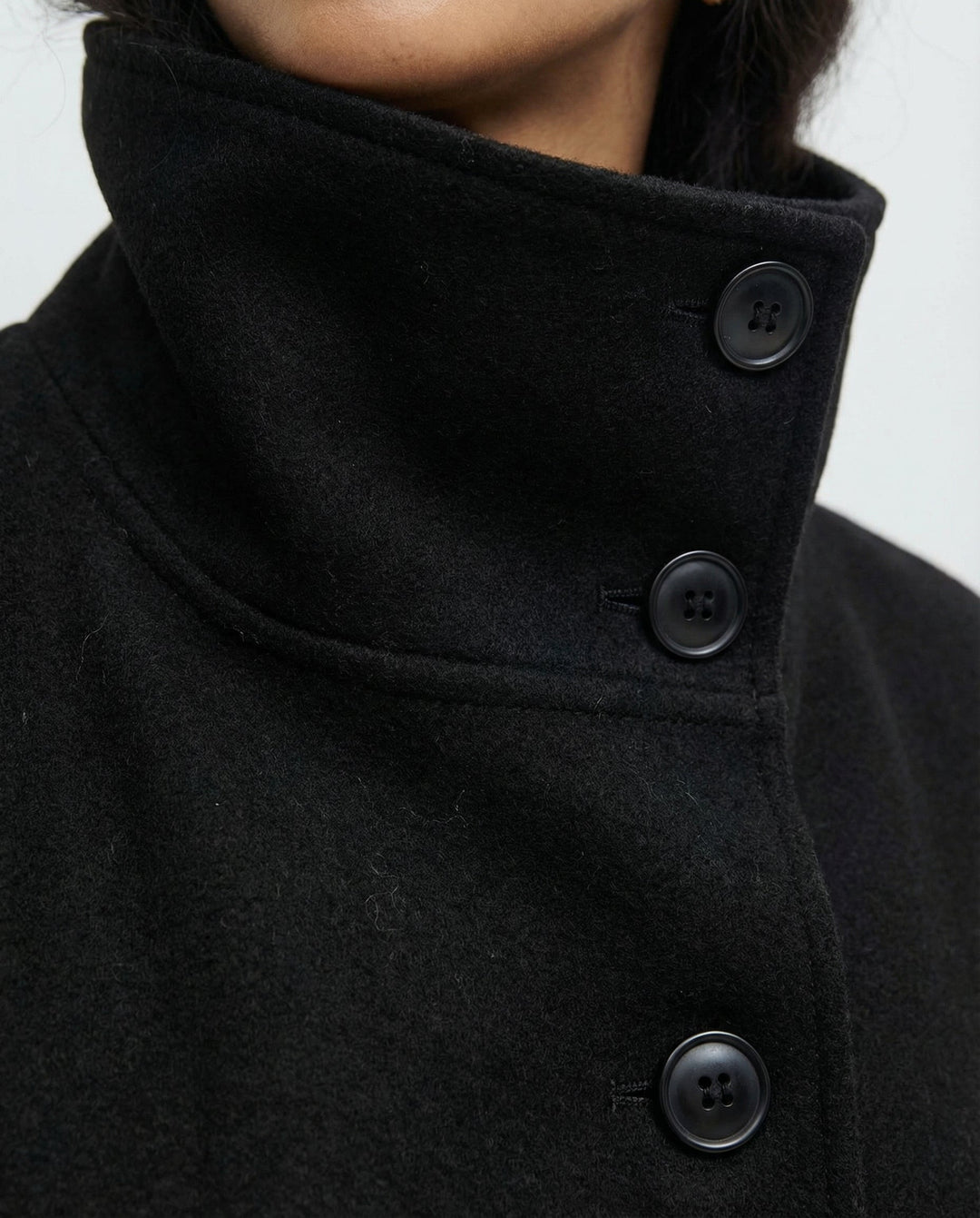 Stylish outerwear trench coat with tie belt and warm collar, back view