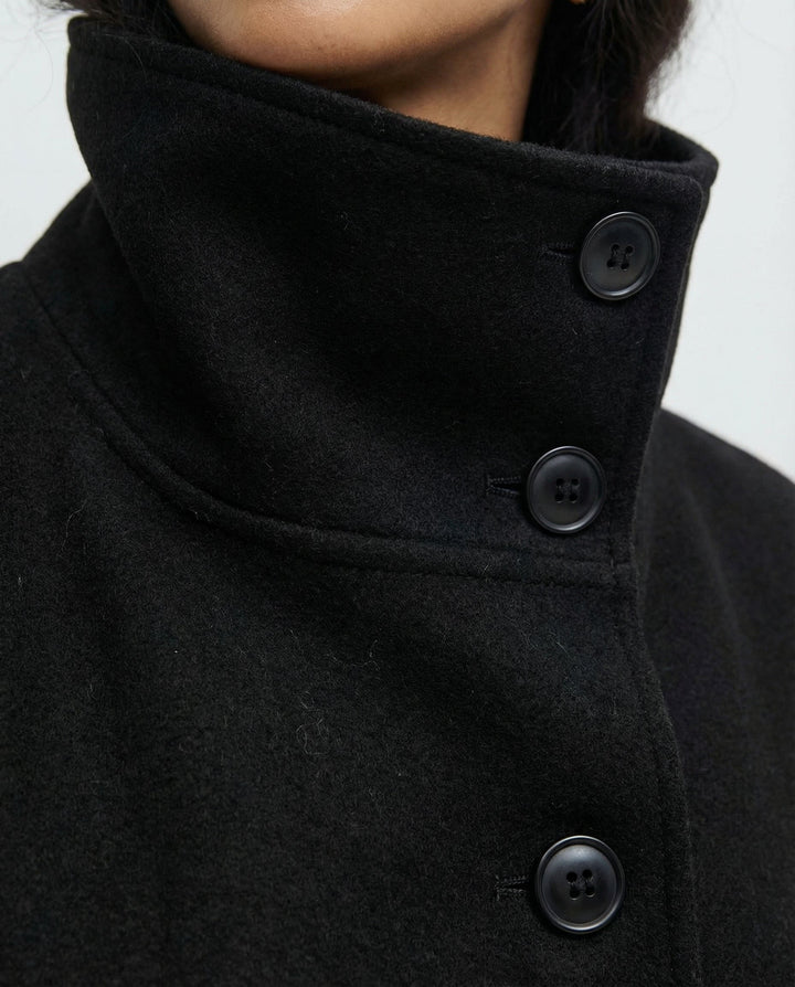 Stylish outerwear trench coat with tie belt and warm collar, back view