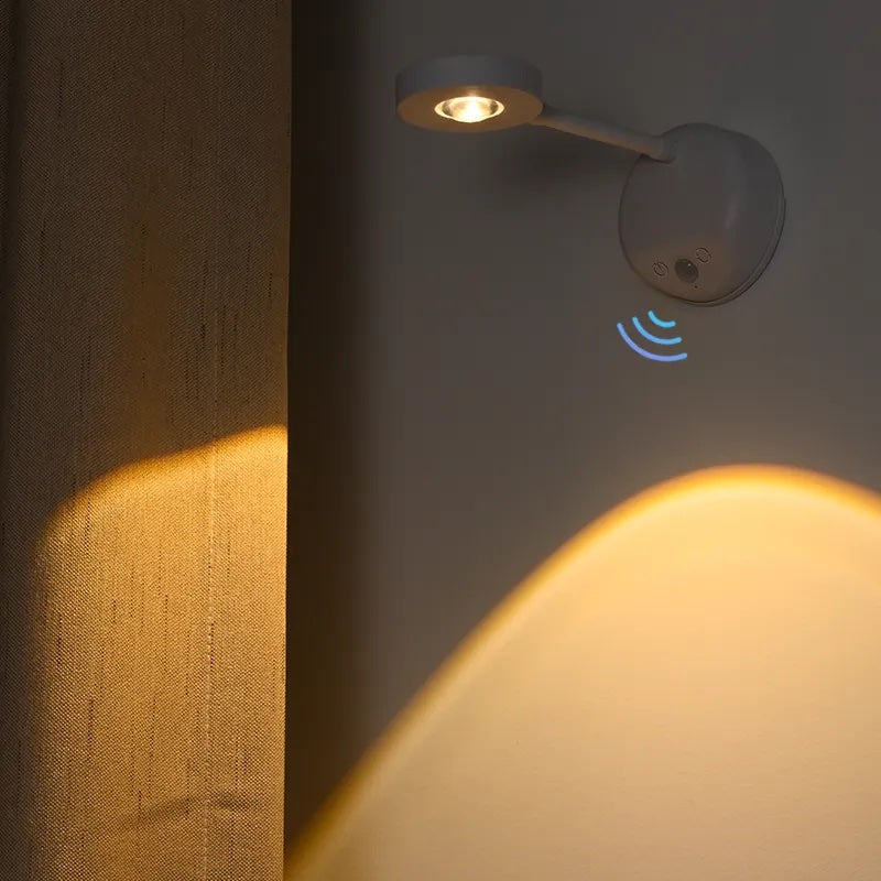 Rechargeable cordless picture light mounted above artwork for gallery illumination