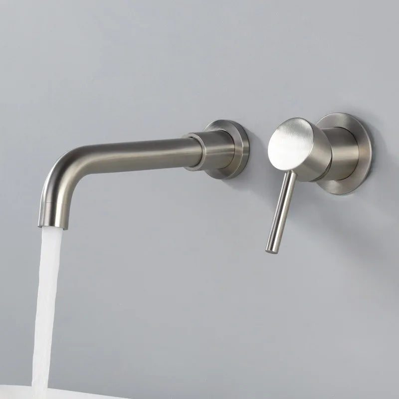 Brushed nickel wall faucet operating over a basin