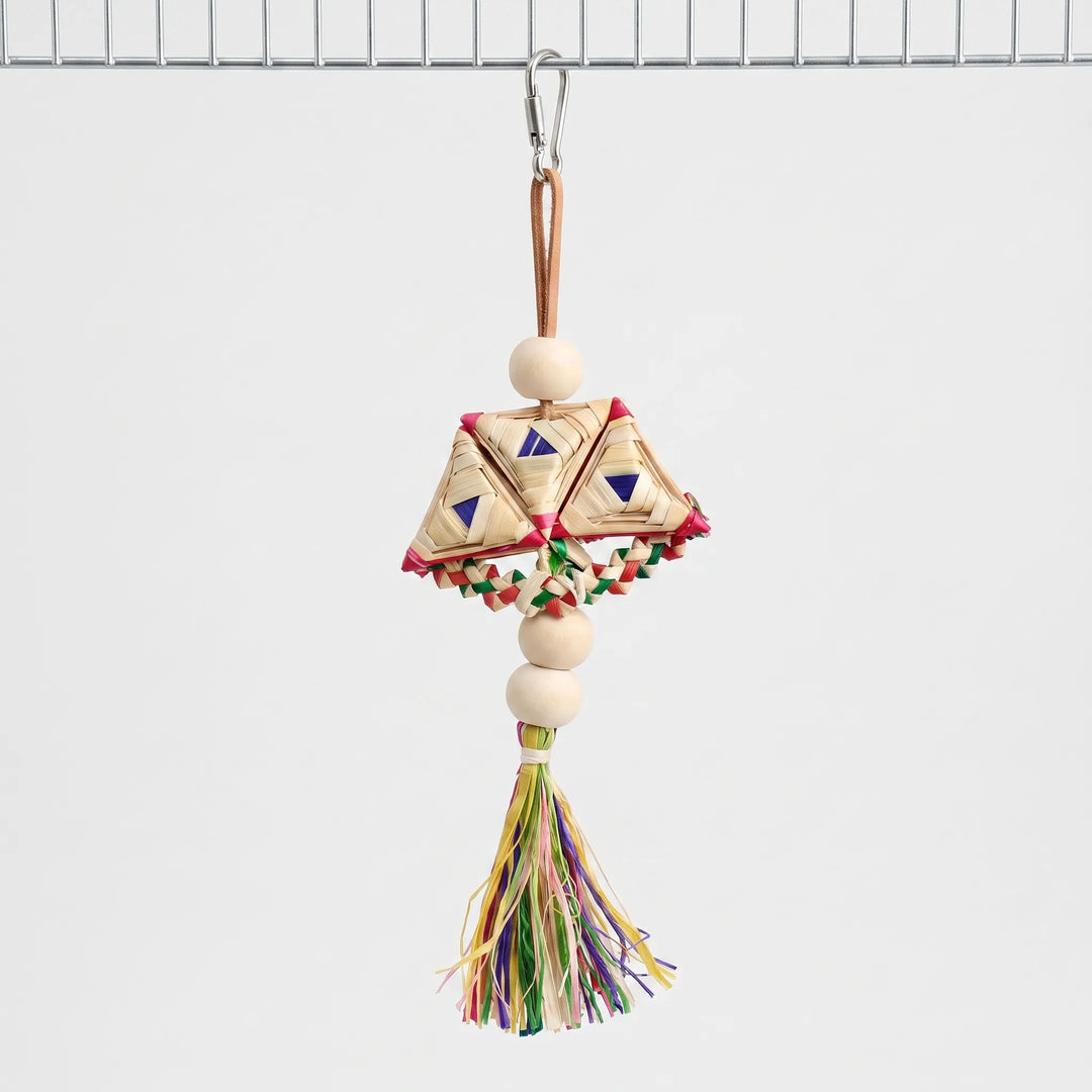 Kippo braided bird toy hanging from a metal bar against a neutral background