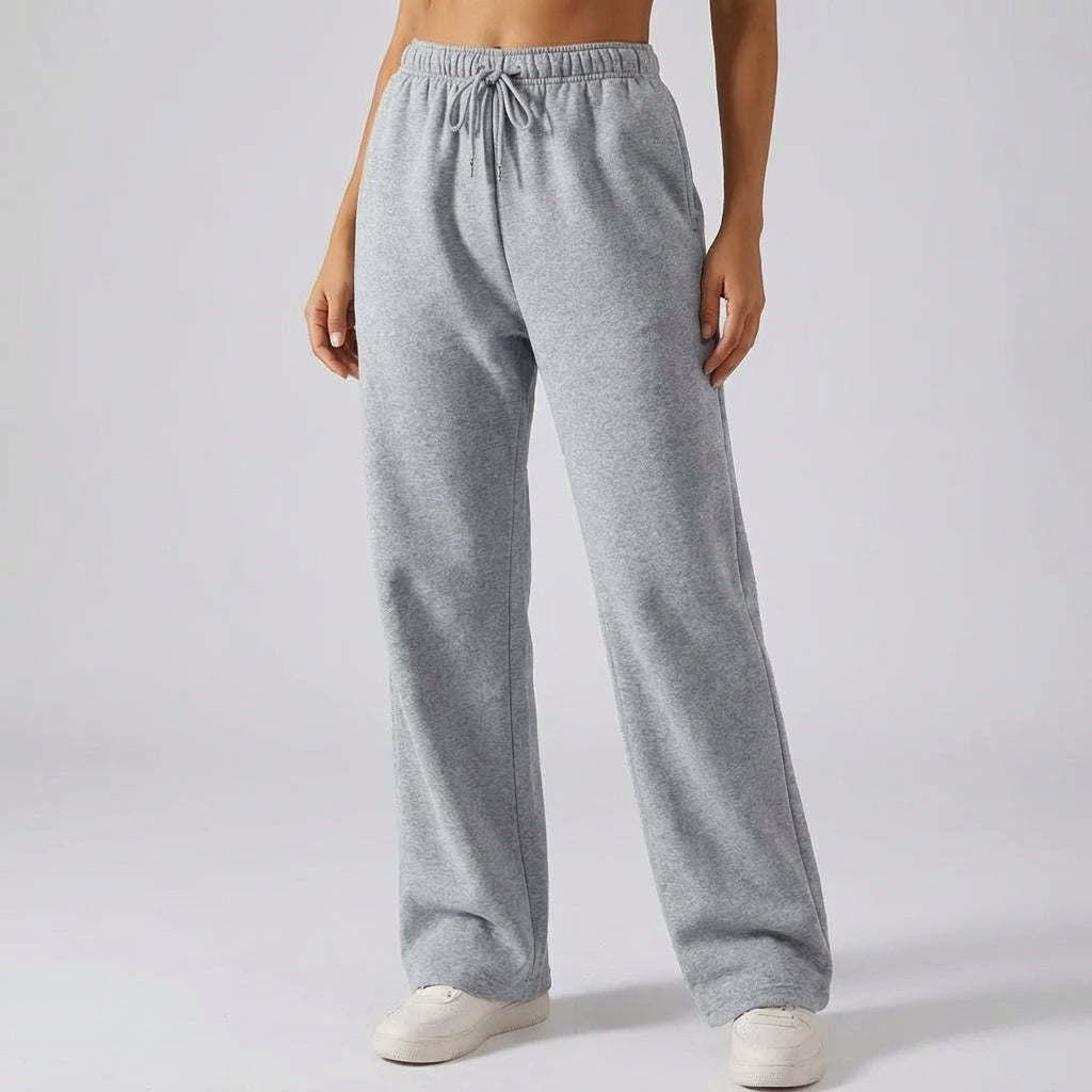 Grey women's lined wide-leg joggers showing relaxed fit and soft interior fabric