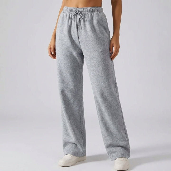 Grey women's lined wide-leg joggers showing relaxed fit and soft interior fabric