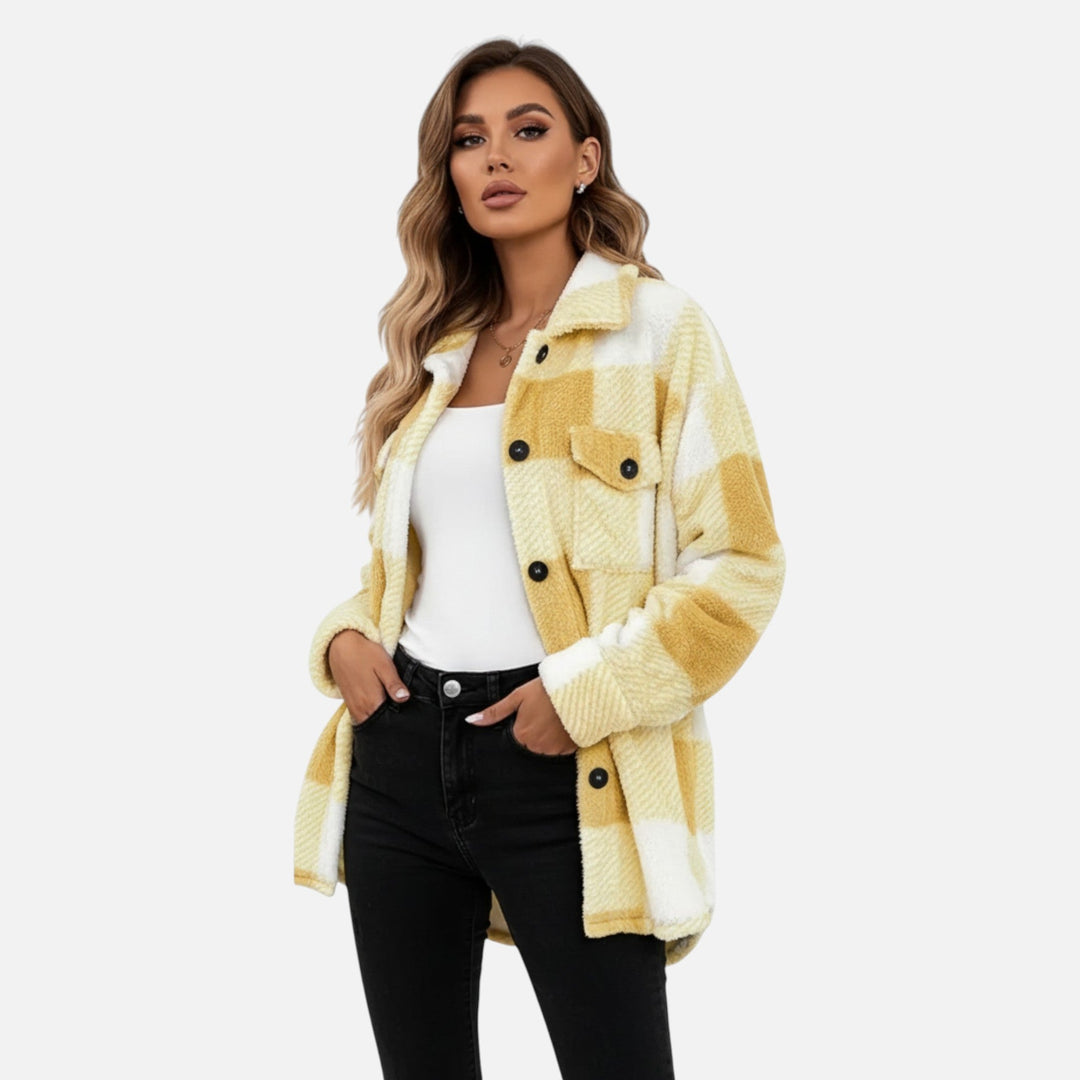 Model posing in a khaki plaid button-up shacket