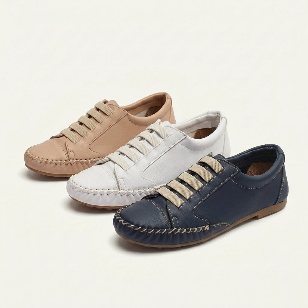 Three pairs of women's comfortable slip-on loafer sneakers in beige, white, and navy blue