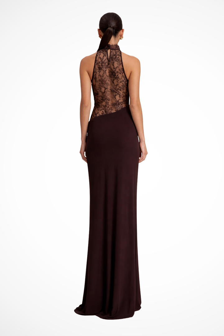 Back view of a woman showcasing the sheer lace back panel of the maxi dress