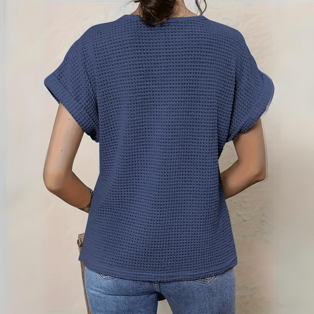 Detailed shot of the fabric texture and lace pattern on the blouse