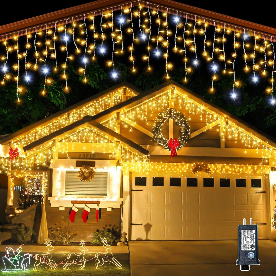 Outdoor holiday lighting featuring cascading warm white Christmas curtain lights