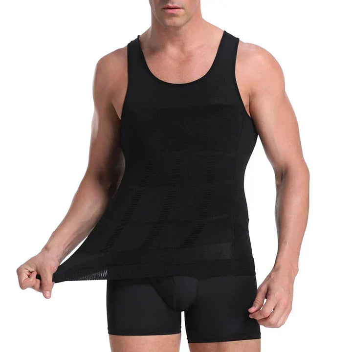 Man wearing a black men's compression undershirt showing elasticity