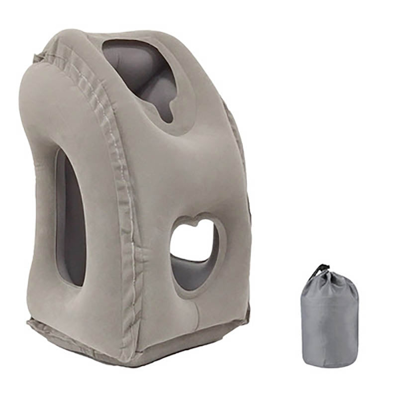 Grey inflatable travel pillow next to its compact carrying bag