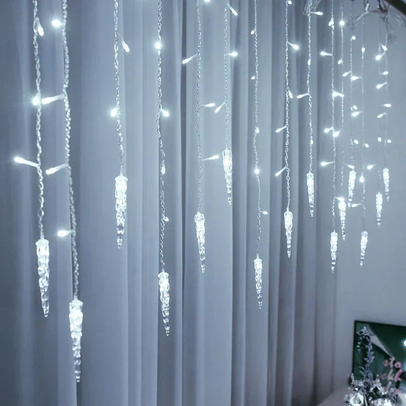 Glacia LED light curtain hanging outdoors, casting a magical glow for holiday lighting.