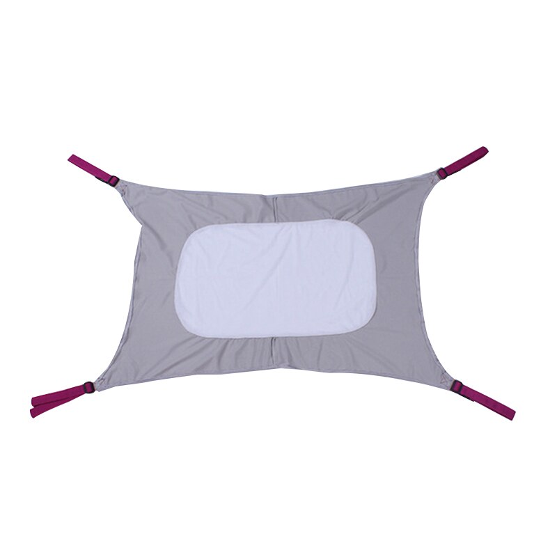 Pink infant bed hammock accessory hanging inside a modern baby playpen