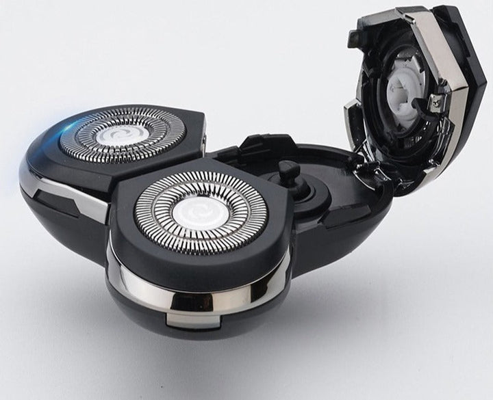 Close-up view of the open dual-ring shaving head mechanism