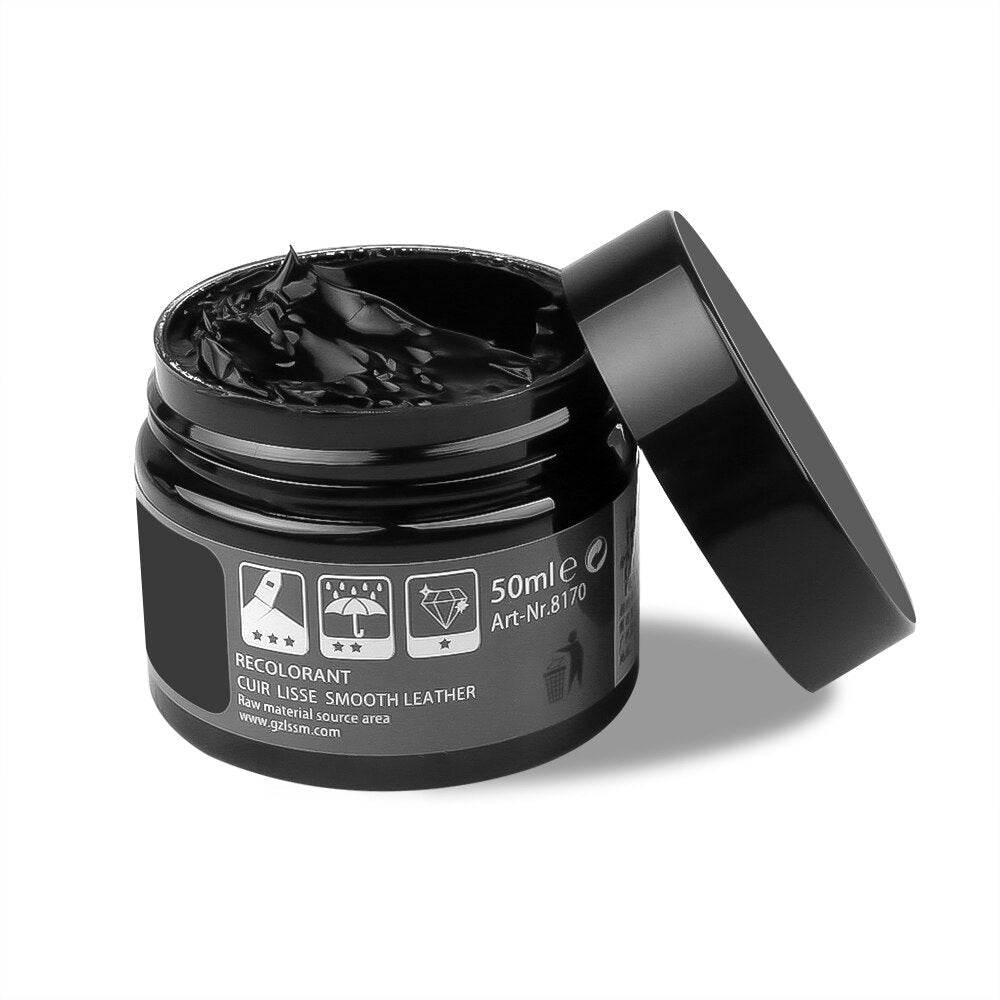 Black leather restoration balm jar with open lid showing smooth paste