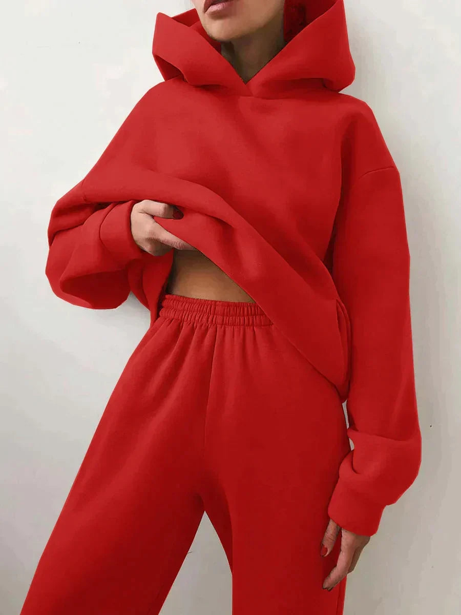 Back view of the women's tracksuit showing the relaxed fit and matching joggers