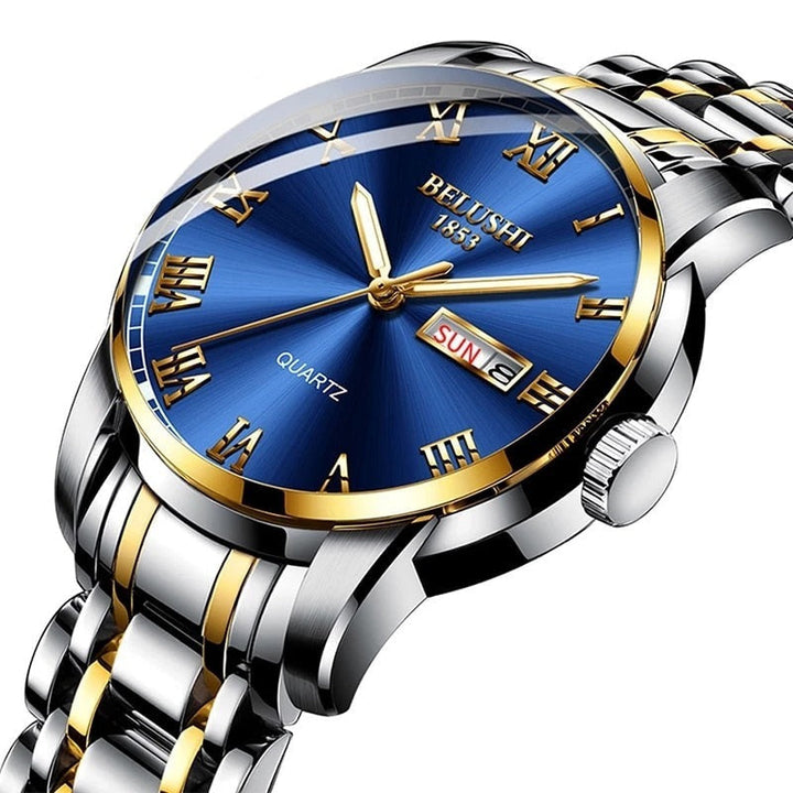 Close up of men's luminous watch with blue dial and two tone strap