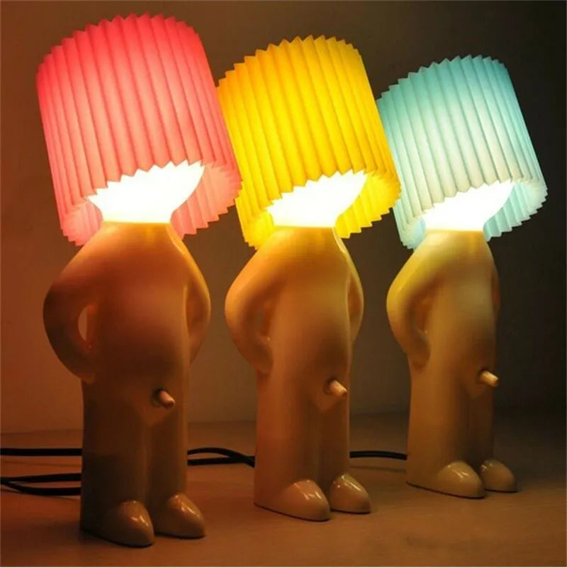 Pink, yellow, and blue quirky cordless LED lamps lined up