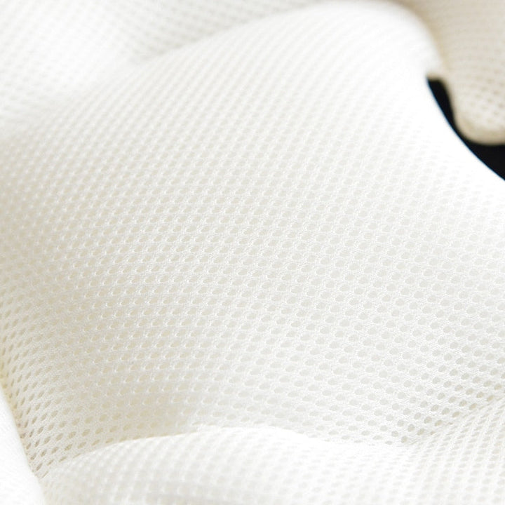 Cute printed pram pad installed in a pushchair for maximum infant comfort