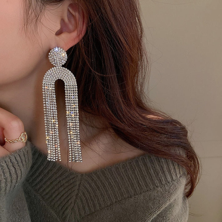 Luxury gold drop earrings adorned with brilliant cut rhinestones