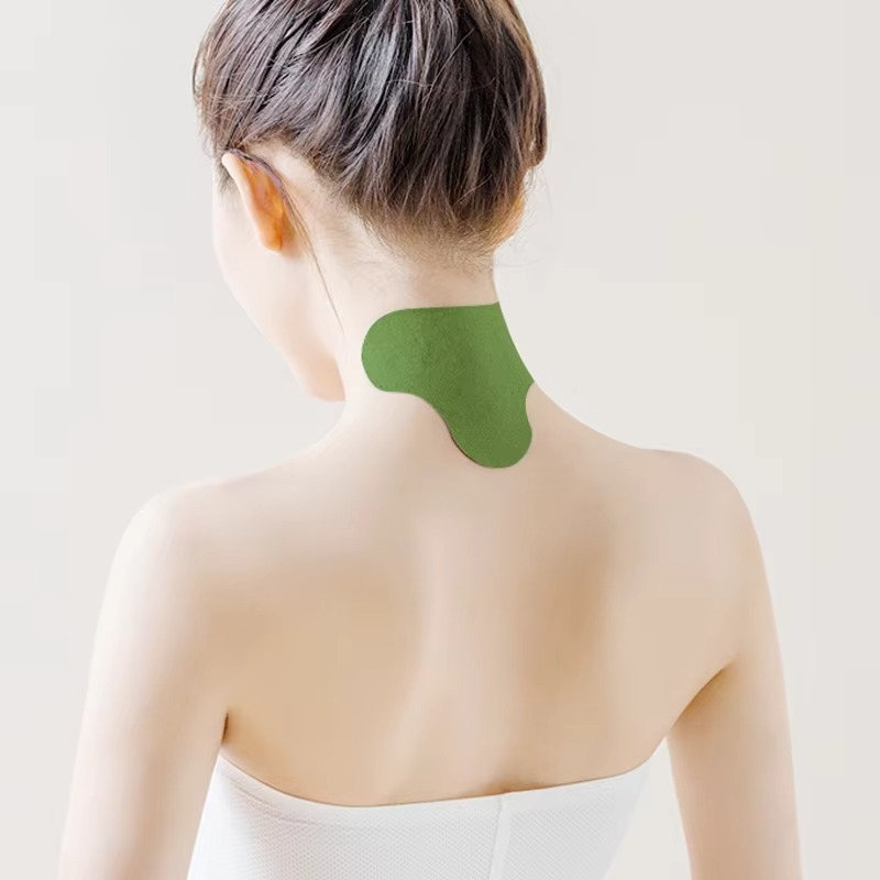 Close-up of a woman wearing a herbal cervical spine patch on her neck against a neutral background.