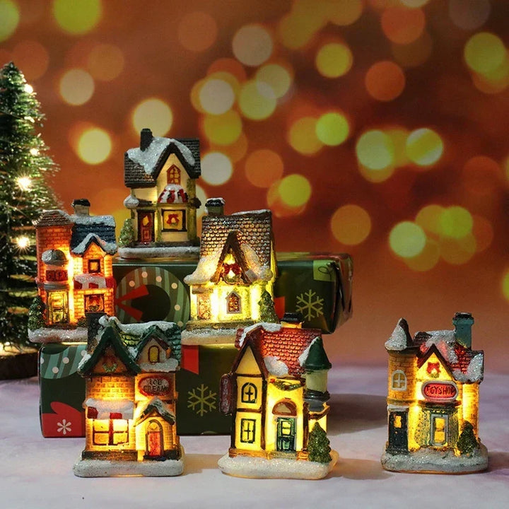 Collection of light-up Christmas village houses displayed together